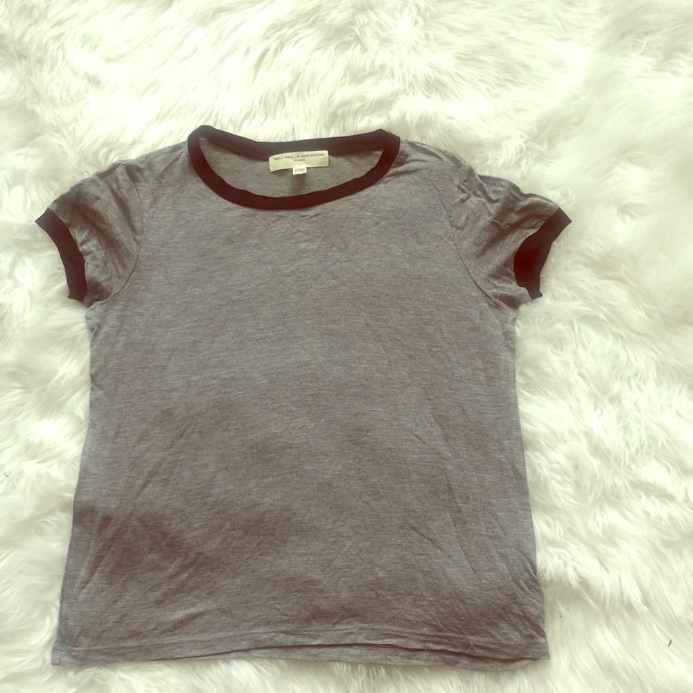 Grey trim in black tee shirt